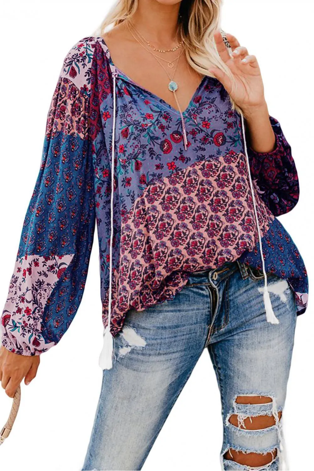 Blusa morada con estampado floral